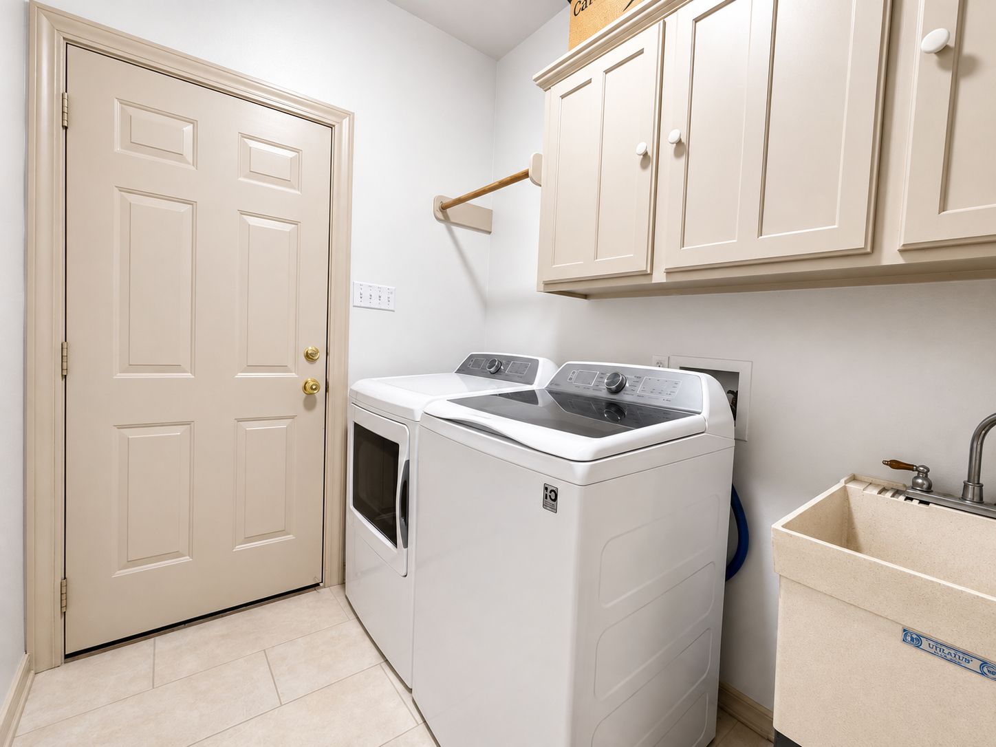 Well appointed utility room with abundant cabinet storage and utility sink Well appointed utility room with abundant cabinet storage and utility sink